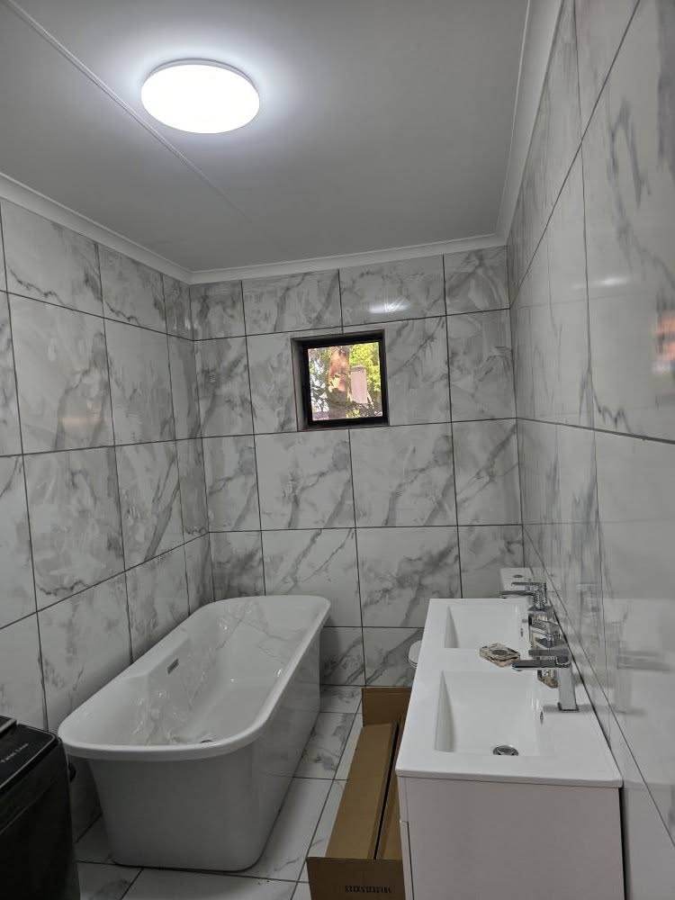 Renovated bathroom with freestanding bath